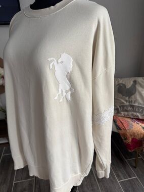 Wildfox Cream Crewneck Sweater W White Horse emblem and crochet trim on sleeve
